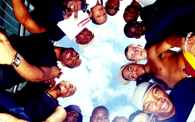 Members of So Solid Crew looking down at the camera