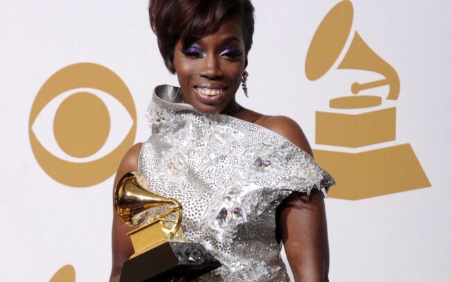 Estelle holding a Grammy award